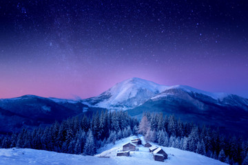 A small village in the snow-covered Carpathians - Powered by Adobe
