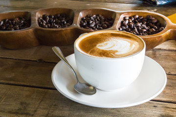Cappuccino or latte coffee with art shape, coffee cup for backgr