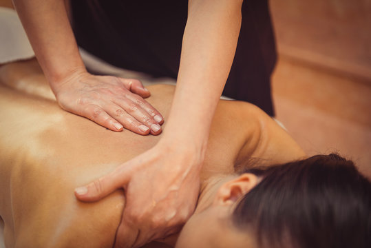 Young woman getting professional massage