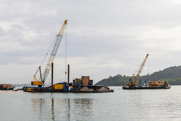 Fototapeta premium Sand replenishment ship on shore for land reclamation