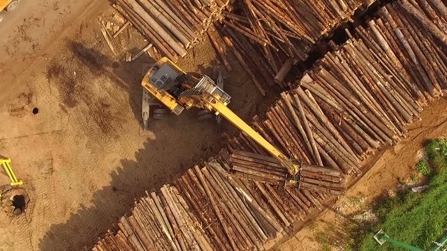Woodworking plant. Loading logs. quadrocopter