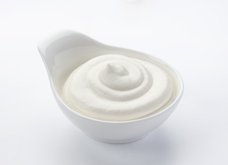 Isolated sour cream in bowl on white background