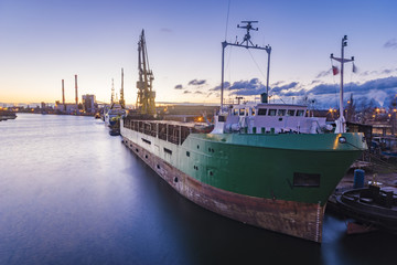 Naklejka premium merchant ship in a repair yard