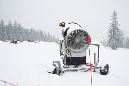 A snow cannon being used to cover a mountain - Snowmaking