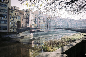 Naklejka na ściany i meble River reflection houses and bridges famous landmark in Girona