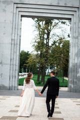happy bride and groom at a park on their wedding day