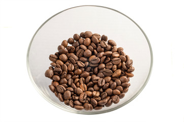 Roasted coffee beans on a glass transparent plate, isolated on white background.