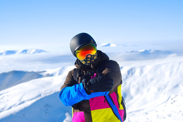 Fototapeta na wymiar snowboarder standing on the top of the mountain