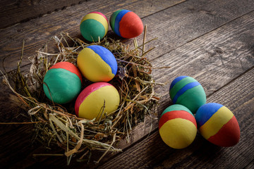 painted Easter eggs on wooden background