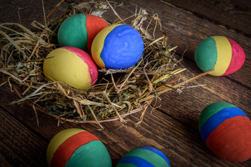 painted Easter eggs on wooden background