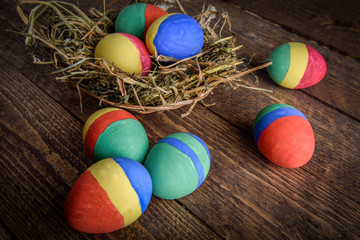 painted Easter eggs on wooden background
