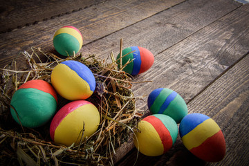 painted Easter eggs on wooden background