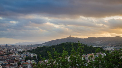 Blue yellow clouds on hills near Barcelona, Spain