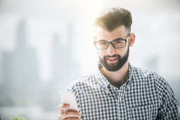 Bearded man using cellphone