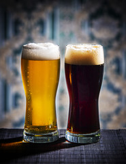 Glasses of light and dark beer