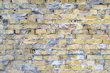 brick wall of broken bricks