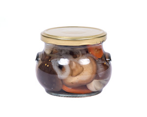Shiitake marinated mushrooms in jar isolated on white background