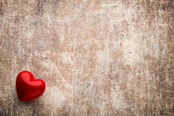 Red hearts on the wooden background.