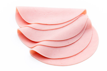 Sliced boiled ham sausage isolated on white background, top view