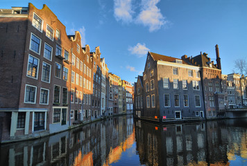 Fototapeta na wymiar View of Amsterdam with houses built on canals 