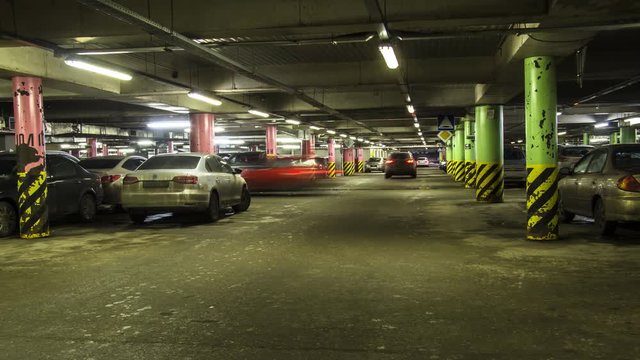 motion in underground parking of hypermarket ,shopping mall ,time lapse
