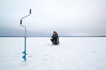 Happy winter fishing in a lake