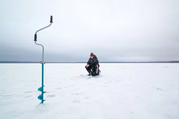 Fotobehang Happy winter fishing in a lake © patho1ogy