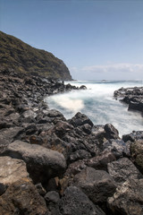 Fototapeta na wymiar Mosteiros dark rocky coastline