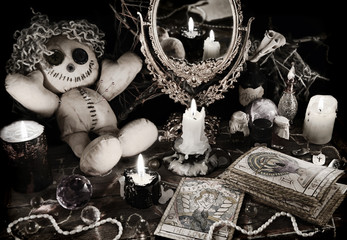 Magic ritual with voodoo doll, mirror and tarot cards in vintage grunge style