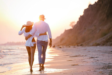 Young happy couple on seashore © Africa Studio