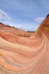 A big, colorful and swirling sandstone rock formation at the entrance way of The Wave - a dramatic erosional sandstone rock formation located in North Coyote Buttes area at Arizona-Utah border.  