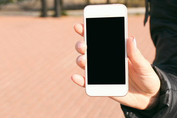 Closeup of female hand holding smartphone