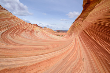 Colorful and swirling sandstone rock formation at The Wave - a dramatic and colorful erosional sandstone rock formation located in North Coyote Buttes area at Arizona-Utah border. 
