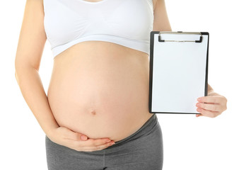 Closeup of pregnant woman with clipboard isolated on white