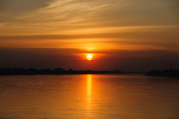 Sunset on the river sides of Thailand and Laos. The photo was taken from Thailand side in the evening.