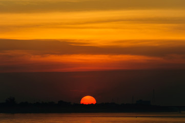 Sunset on the river sides of Thailand and Laos. The photo was taken from Thailand side in the...