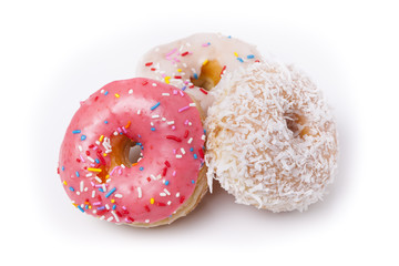 Three donuts isolated on White Background. Pink, Frosted and Coconut with sprinkles.