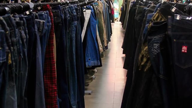 View of Racks with Colorful Men Shirts in Shop