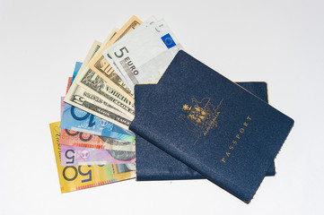 Fototapeta premium 2 well worn Australian passports and currency from US, Europe and Australia.