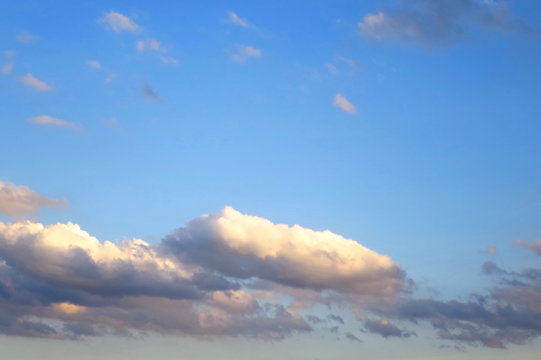 blue sky with colorful comulus cloud in the evening. Soft focus.