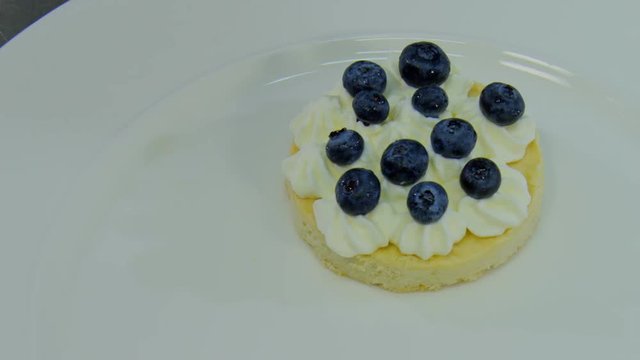 spread the blueberries on the cream.