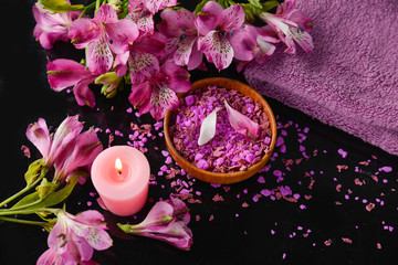Spa feeling with towel ,salt in bowl ,candle , towel ,orchid