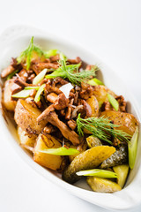 Fried baked potatoes with chanterelle mushrooms