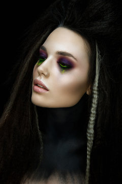 Fashion woman portrait in gothic stile. Beautiful witch with glamour make up.
