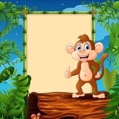 Cartoon monkey standing on hollow log near the empty framed signboard 
