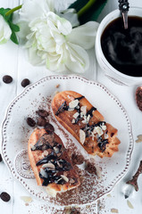 Tasty eclairs on table