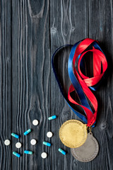 Concept of doping in sport - deprivation medals top view