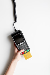 payment terminal with card on white background top view