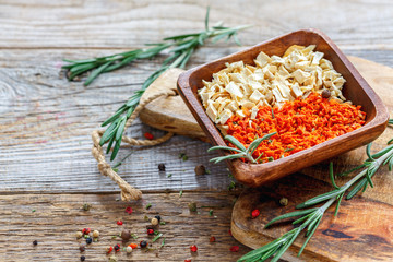 Bowl with dried carrots and celery root.