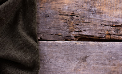 knitted plaid, sweater on old wooden boards